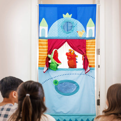 Kids playing with HABA Puppet Theater